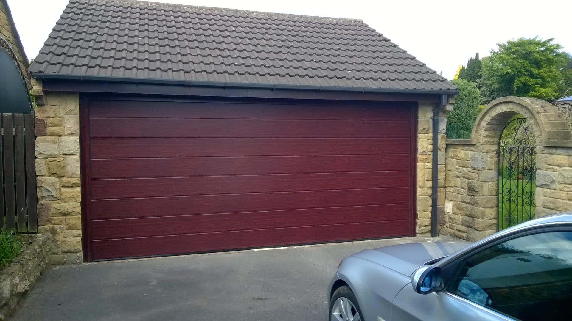 Hormann M Ribbed Sectional Garage Door in Rosewood By ABi