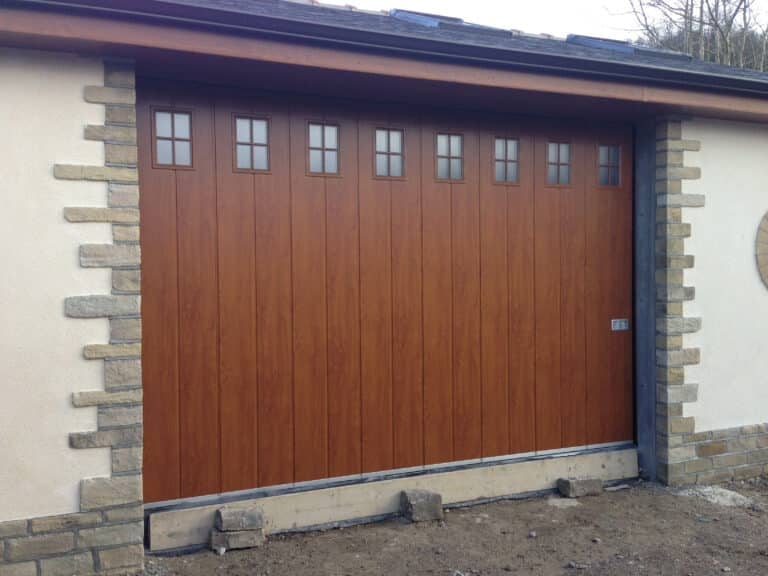 Hormann Vertical Side Sliding Garage Door in Decograin with Glazing By ABi Garage Doors