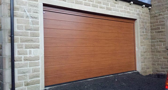Peter Holmes Developments commission ABi Garage Doors to install a Hormann LPU40 medium ribbed design 42mm Insulated sectional garage door in Halifax