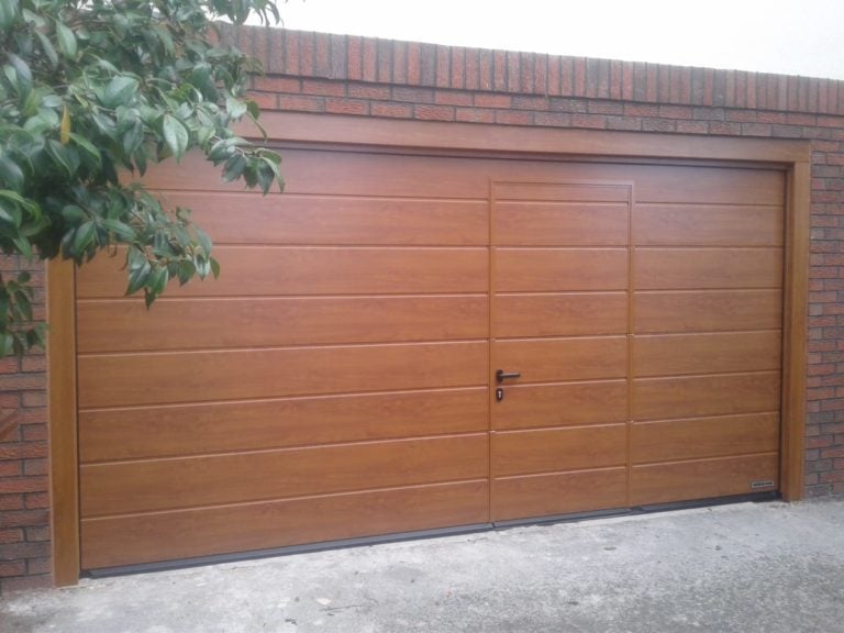 Hörmann Sectional Garage Door in Brown with a Wicket Door