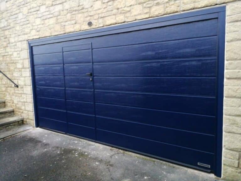 Hörmann Sectional Garage Door With a Wicket Door in Blue