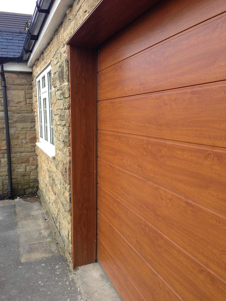 Hormann LPU40 Decograin timber effect sectional garage door installed in Leeds