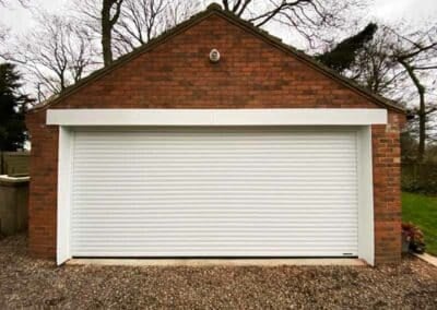 Double Width Garage With Double Roller Garage Doors in White