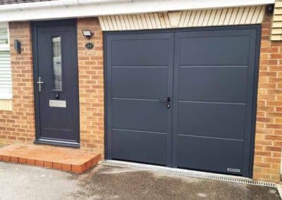 Anthracite grey side hinged garage door with matching front door