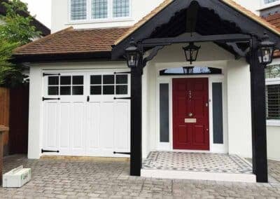 White side hinged garage constructed from wood in white