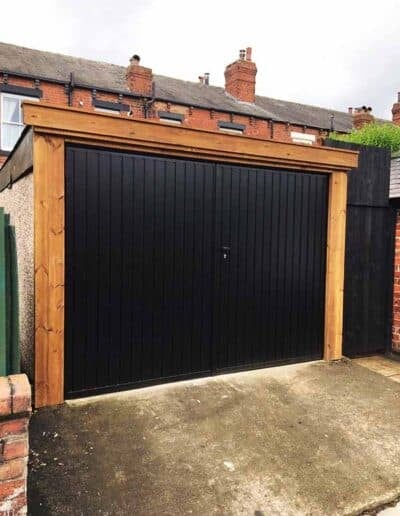 Side hinged garage door finished in black