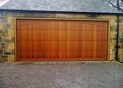 Wooden sectional garage door constructed from Cedar wood