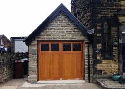 Timer Up and Over Garage Door Constructed From Wood with Windows