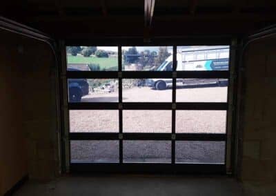 View from inside the garage of aluminium frame sectional garage door
